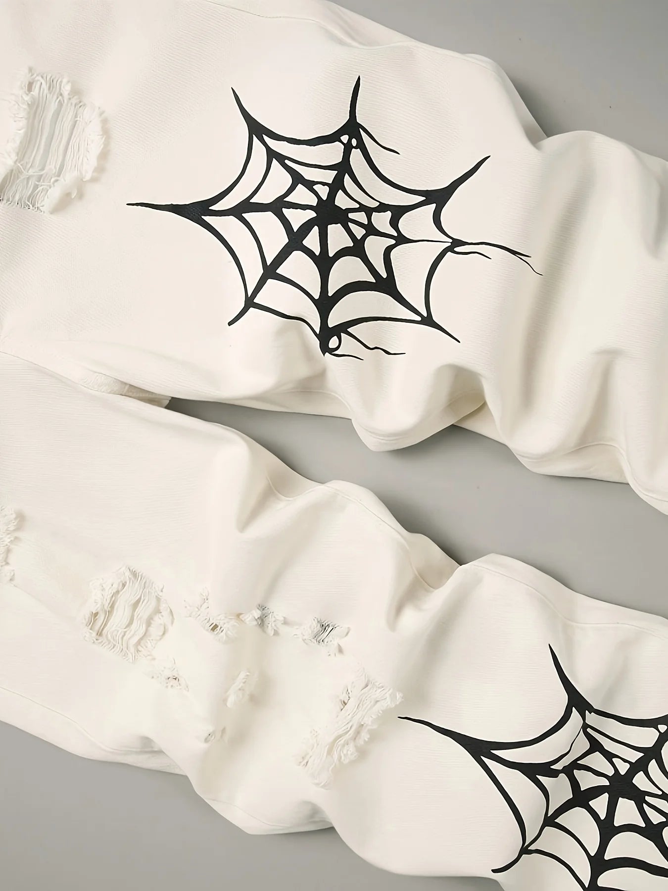 Distressed Spider Web Jeans